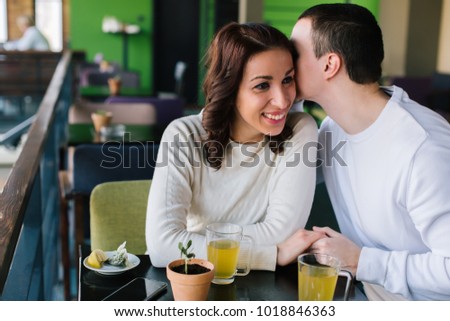 Couple in love sitting in cafe