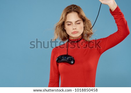  woman with joystick, wire on neck on blue background                              