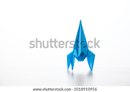 Paper homemade origami rocket. Craft work for children Royalty-Free Stock Photo #1018910956