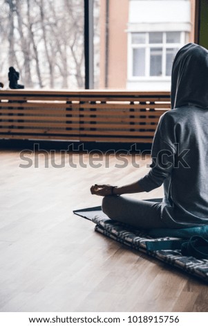 Young woman meditates while practicing yoga. Freedom concept. Calmness and relax, woman happiness. Toned picture.
