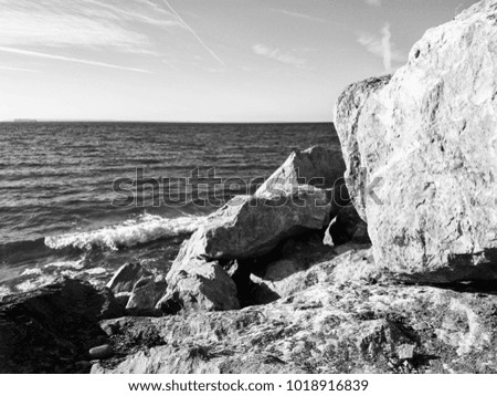 Photo of the stones at the Brighton Beach in Brooklyn, NYC, NY, USA captured on a sunny day