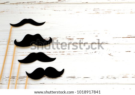photo props - black paper mustache on white vintage  background