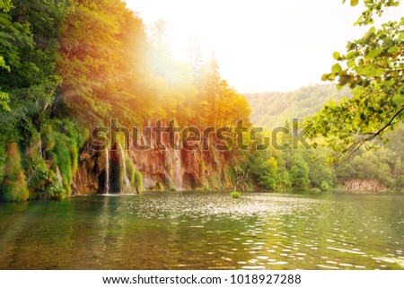 Warm sunlight in Lake Plitvice National Park in summer. Sun, Waterfalls and pure nature