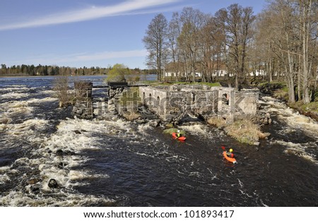 Shutter-speed surfing in a river at spring