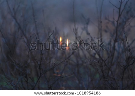 A candle in the reflection of a window Royalty-Free Stock Photo #1018954186