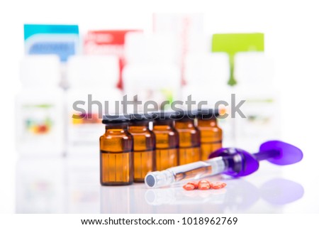 Composition of medicine bottles and pills on white background

