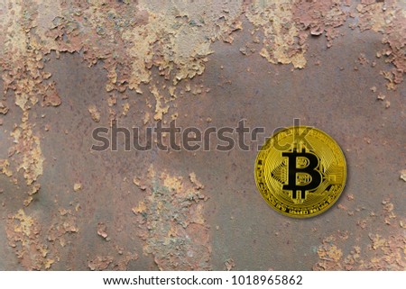 golden bitcoin lie on abstract rusted  background