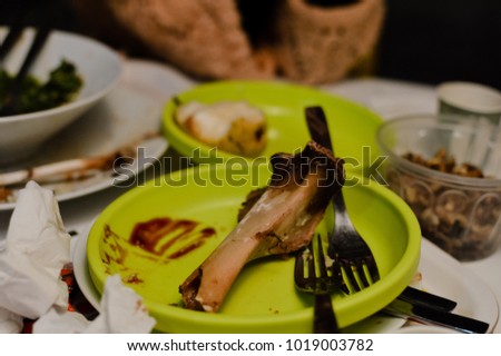 Closeup on dirty plates after eating dishes on the table abstract food industry background. Clean and wash time. Closeup photography image
