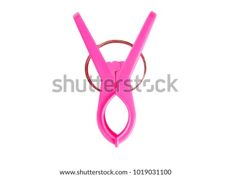 Pink plastic clip isolated on white background.