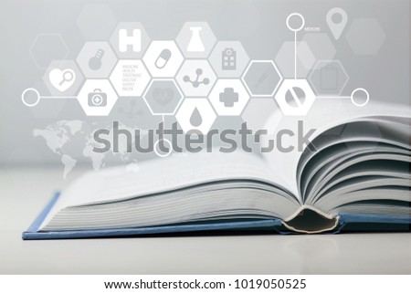 Medicine illustration on open book Royalty-Free Stock Photo #1019050525