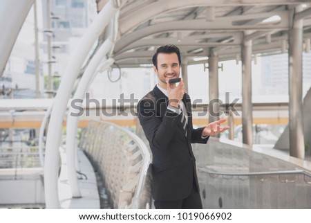 Handsome businessman talking on mobile phone.