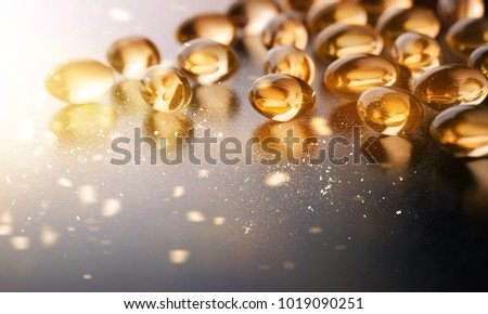 Yellow capsules Omega 3