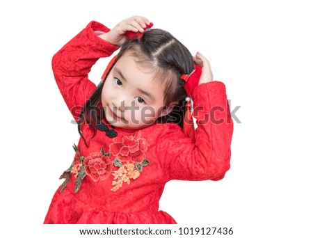 The little girl in the new year is in front of the white background