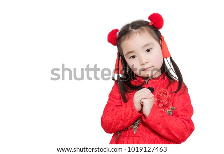 The little girl in the new year is in front of the white background