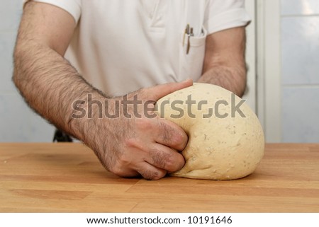 Baker working with dough
