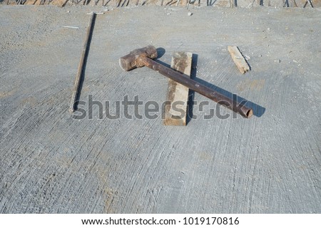 Construction hammer on cement floor.