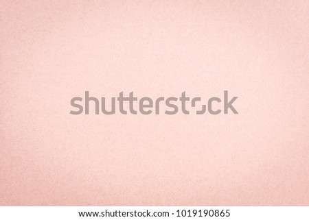 Craft paper pink or rose gold textured background