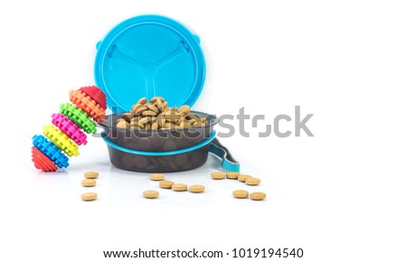 Portable bowls feeding and food with toys isolated on white background.  