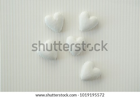Lovely heart-shaped gingerbread cookies on a colourful background