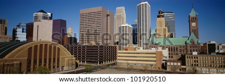 This is the compact skyline of Minneapolis in daylight.