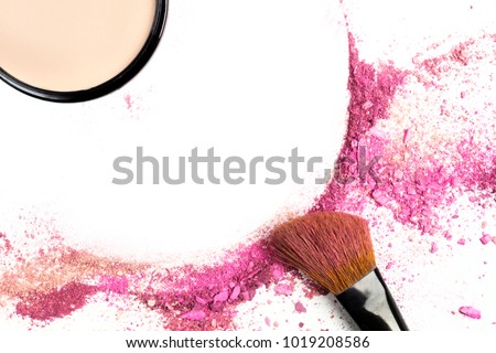 Traces of vibrant pink blush forming a frame, with a makeup brush and a compact powder. A template for a makeup artist's business card or flyer design, with copy space