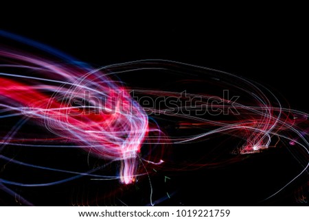 Beautiful Abstract futuristic painting color texture with lighting effect. Modern dynamic shiny pattern. Fractal graphic artwork design. Creative long exposure photography. Abstract lights at night.
