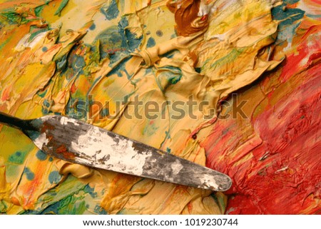 Close up of artists palette, oil paints and palette knife