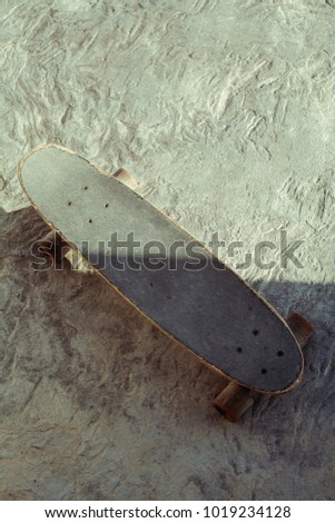 Photo picture of a wooden old skateboard.