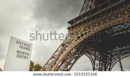 sign indicates the north entry of the Eiffel tower in Paris, France