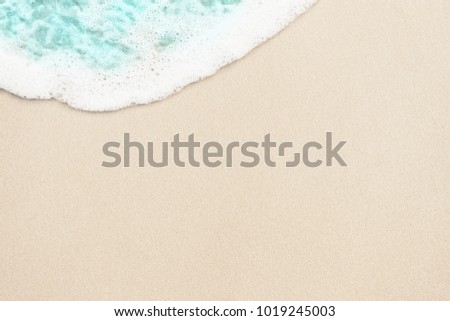Ocean blue wave on the sand background