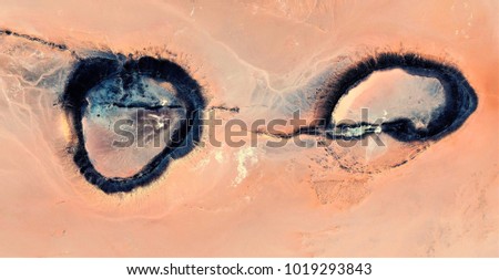 eyes of a woman tortured by religious fundamentalists,abstract photography of the deserts of Africa from the air, aerial view, abstract expressionism, contemporary photographic art,