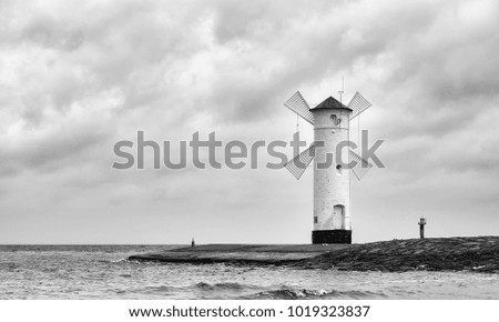 Black and white picture of the windmill lighthouse in Swinoujscie, Poland. 