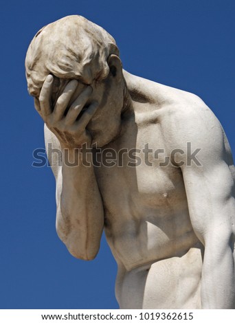 Facepalm statue with head in hands in Paris Royalty-Free Stock Photo #1019362615