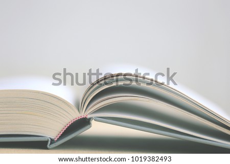 Close-up of open book on the floor selective focus and shallow depth of field
