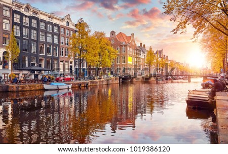 Channel in Amsterdam Netherlands houses river Amstel landmark old european city spring landscape. Royalty-Free Stock Photo #1019386120