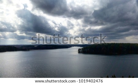 a landscape shot of a lake in summer