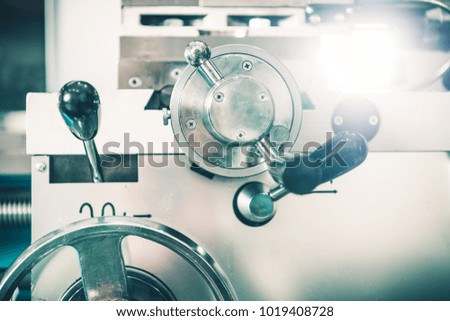 Metal Lathe Adjustment Wheels Closeup Photo. Metalworking Industry Theme.