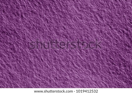 Felt surface in purple color. Abstract background and texture for design.