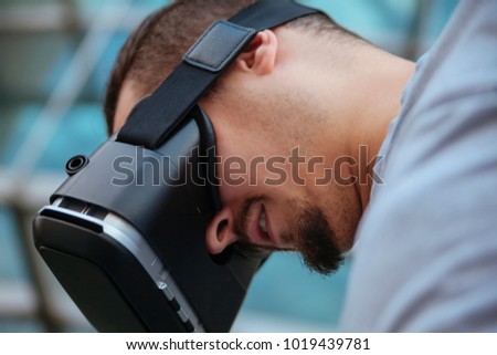 A Young Man Using VR Outdoors