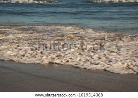 Surf and Waves on the Beach in the Morning