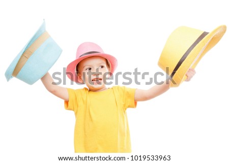 Cheerful smiling dancing child boy in a hat isolated on white