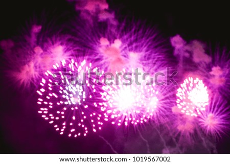 Colorful Abstract blurred fireworks for celebration christmas,happy new year and anniversary background,Motion by wind blurred firework fall on night sky background.Vivid Color vintage  style.