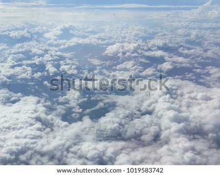 The clouds and blue sky background picture which is window view from airplane