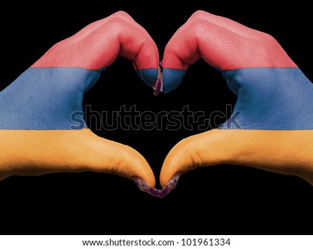 Tourist made gesture  by armenia flag colored hands showing symbol of heart and love