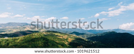 Green mountain with blue sky background. Banner backgrounds with copy space.