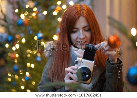 cute young woman taking picture
