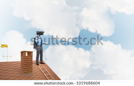 Faceless businessman with camera zoom instead of head standing on house roof