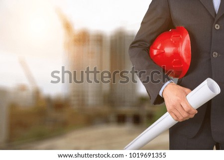 Engineer or Safety officer holding hard hat