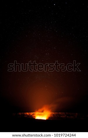 Glowing volcano caldera at night