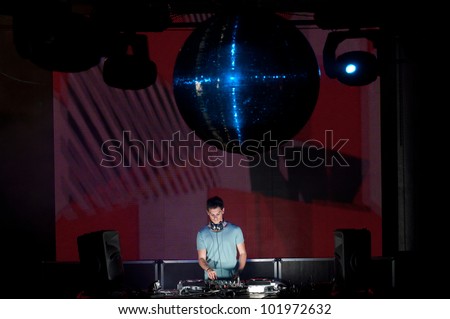 Dj in action, playing disco house music